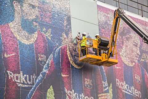 August 10, 2021, Barcelona, Spain: Lionel Messi s photo seen being removed from a poster at the Camp Nou stadium by workers on a crane..The Football Club Barcelona has removed the image of Lionel Messi from the poster outside the Camp Nou stadium. Barcelona Spain - ZUMAs197 0129042543st Copyright: xThiagoxPrudenciox