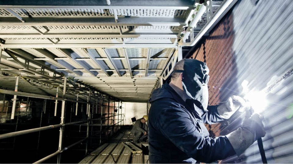 Schweißarbeiten in einem Kohlekraftwerk: Mit der Energiewende kam das Kraftwerksgeschäft zum Erliegen - Foto: Bilfinger