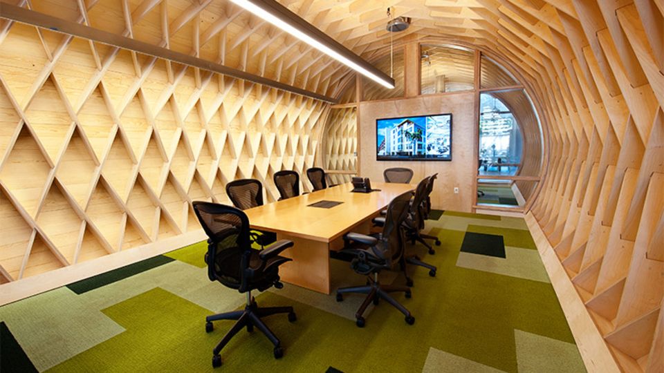 Ein futuristischer Konferenzraum in Form eines Tunnels soll zu konzentrierten Diskussionen anregen. Design: Cuningham Group Architecture
