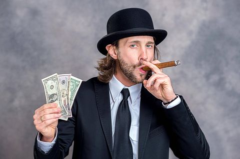 Geld und Zigarre: So sieht das Klischee vom Unternehmer aus