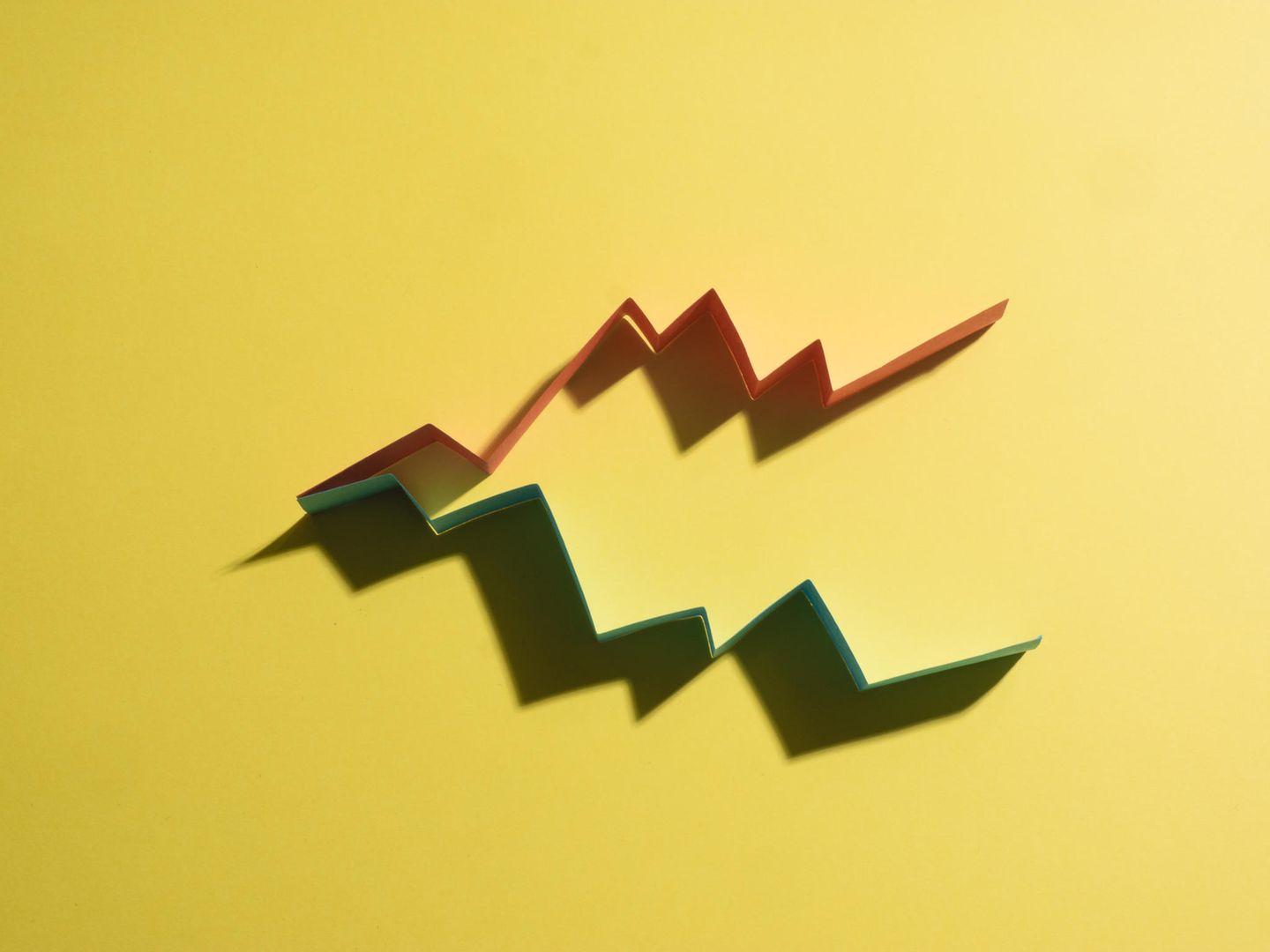 Colourful graphs on yellow background that imitate a bussiness results chart