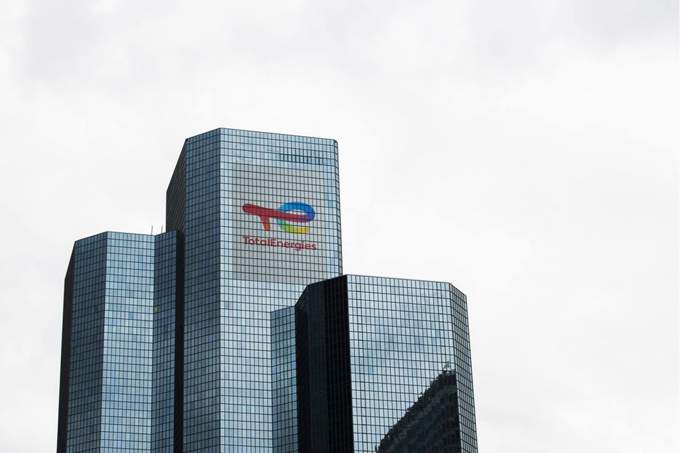 A logo on the TotalEnergies SE headquarters in the La Defense business district in Paris, France, on Monday, July 12, 2021. French energy giant TotalEnergies SE will probably aim to cut the carbon emissions of its clients at a faster pace by 2030 if the European Union adopts more ambitious regulations to fight global warming, Chief Executive Officer Patrick Pouyanne said. Photographer: Nathan Laine/Bloomberg via Getty Images