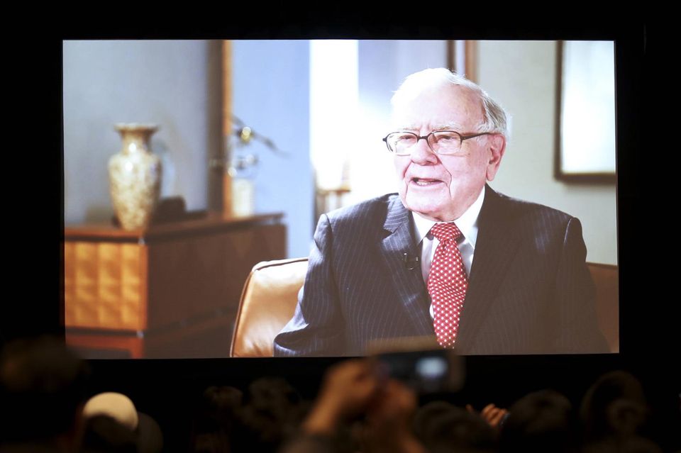 Warren Buffett can be seen on a big screen