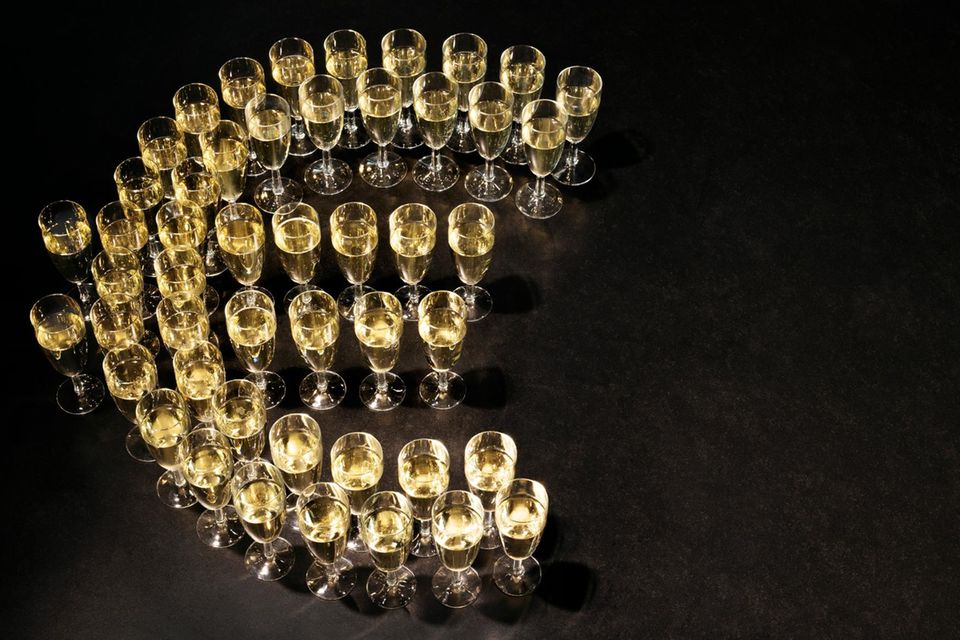 Euro symbol made of champagne glasses